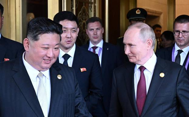 Russian President Vladimir Putin meets with North Korean leader Kim Jong Un in Beijing