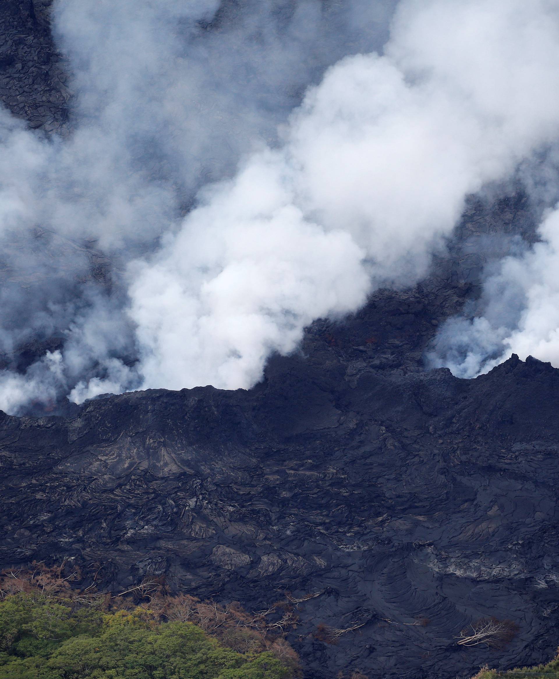 Volcanic gases rise from a fissure on the lava field in the Leilani Estates near Pahoa, Hawaii