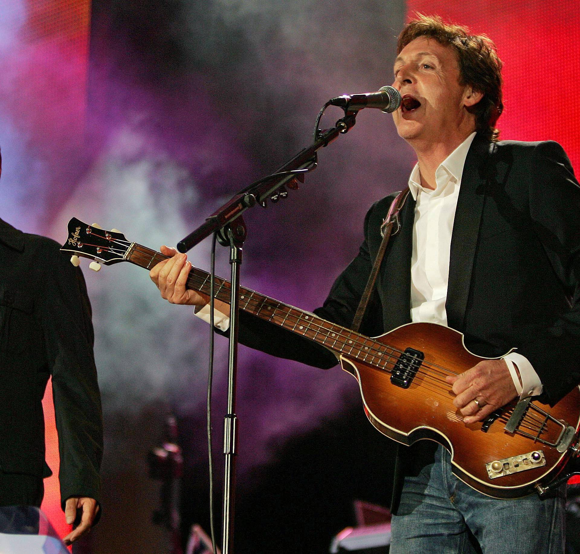 FILE PHOTO: British singers Paul McCartney and George Michael perform at the Live 8 concert in Hyde Park in London