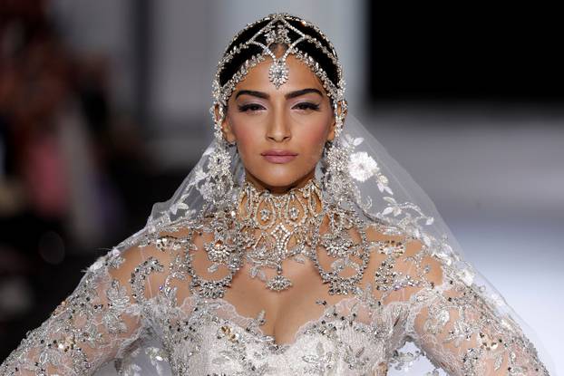 A model presents a wedding dress by australian designers Tamara Ralph and Michael Russo as part of their Haute Couture Fall/Winter 2017/2018 collection show for Ralph & Russo in Paris
