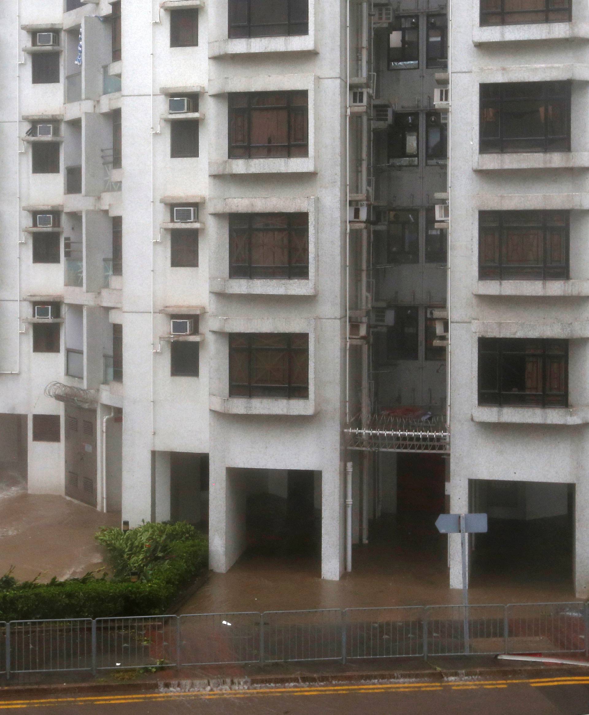 High waves hit the shore at Heng Fa Chuen, a residental district near the waterfront, as Typhoon Mangkhut slams Hong Kong