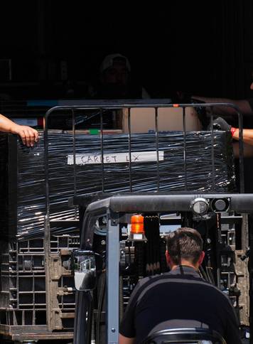 Workers unload items from trucks at Madison Square Garden, in New York City