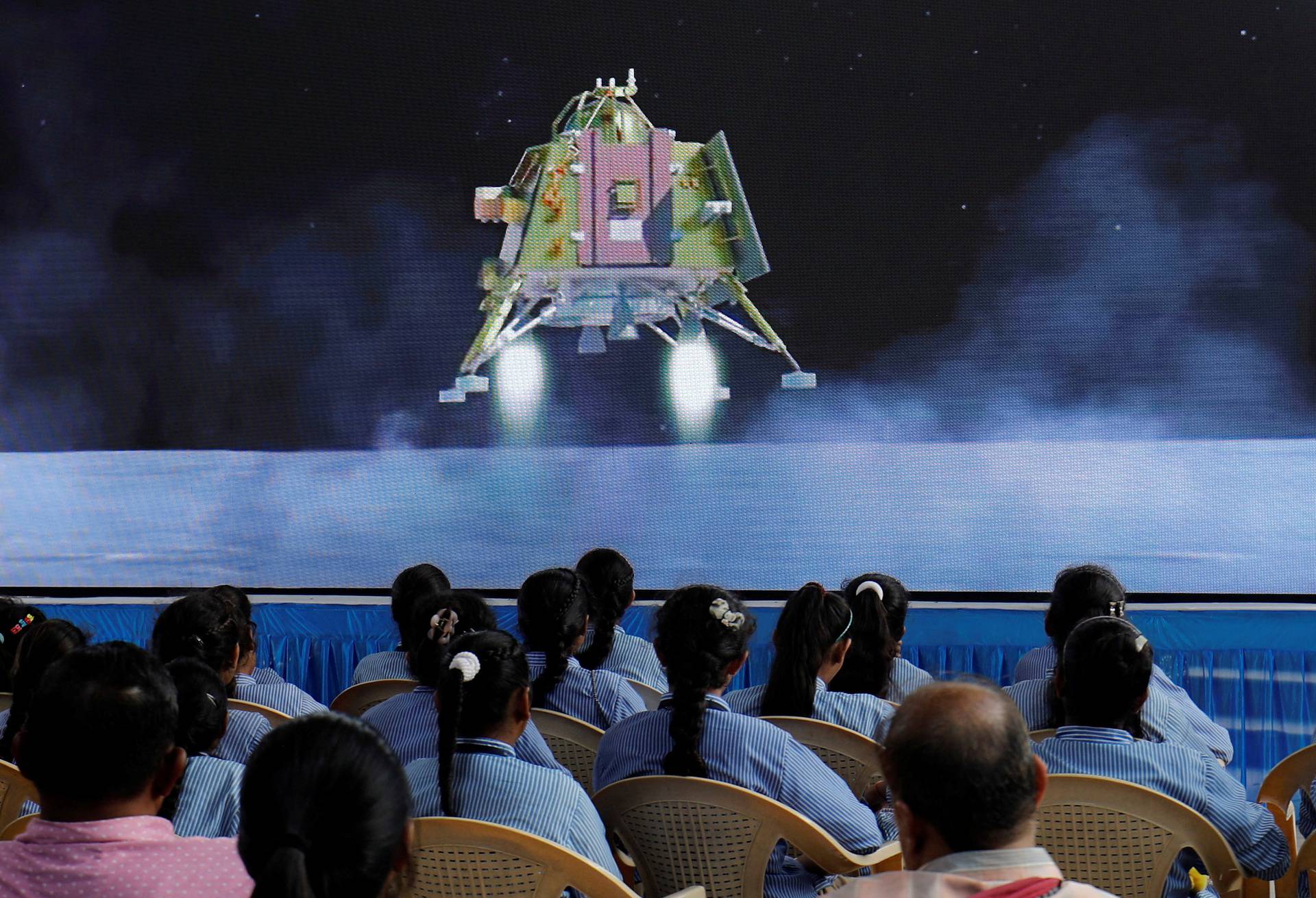 People watch a live stream of Chandrayaan-3 spacecraft's landing on the moon, in Ahmedabad