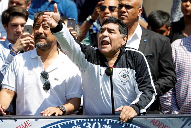 Football legend Diego Maradona reacts during an advertising event on the eve of the opening of the UEFA 2016 European Championship in Paris