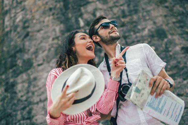 Tourist couple enjoying sightseeing and exploring city