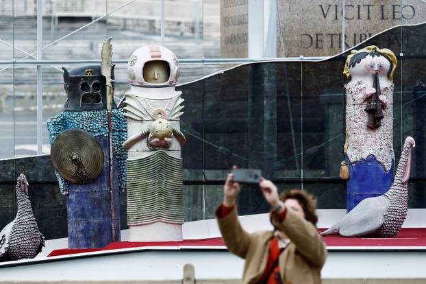 An astronaut figurine stands among the nativity scene display at the Vatican