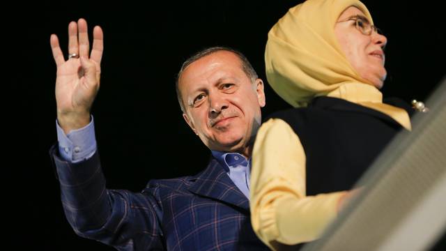 Turkish President Tayyip Erdogan with his wife Emine greet supporters near Tarabya mansion in Istanbul,