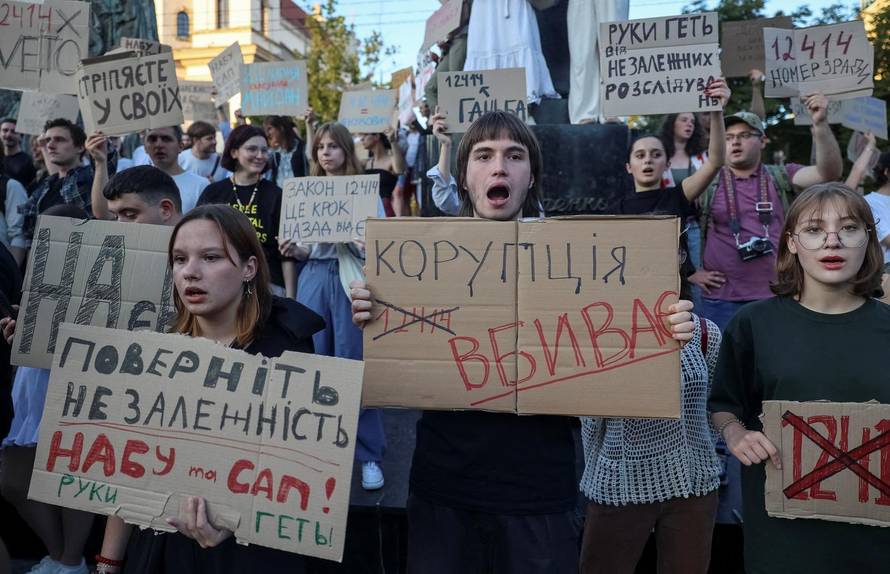 Ukrainians protest against a newly passed law, which curbs independence of anti-corruption institutions in central Lviv