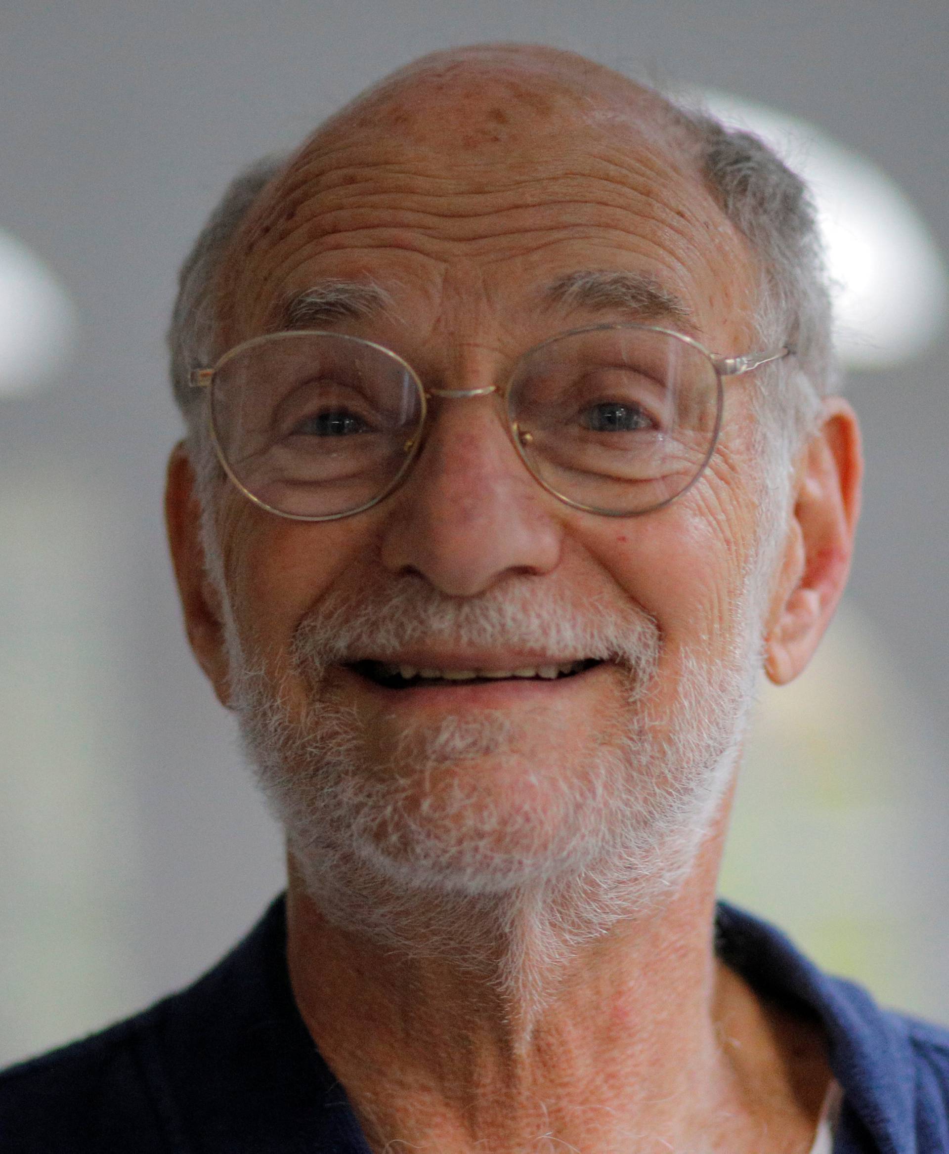 2017 Nobel Prize in Physiology or Medicine winner Michael Rosbash, a Brandeis University professor, stands in the doorway of his home in Newton