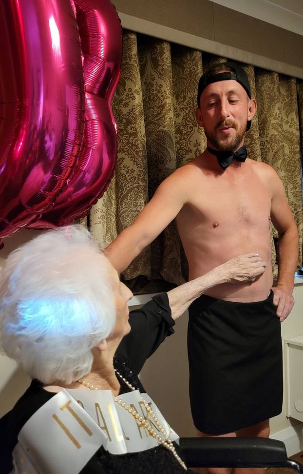 Tea and beef-cake! OAP gets Butler in the Buff for her 103rd birthday at care home