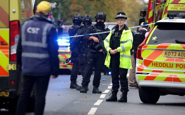 Emergency personnel work at the scene following an incident outside a synagogue, in Manchester