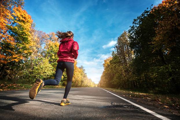 Lady runs on the road