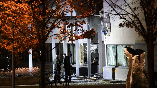 Police forensics work at the scene after a powerful explosion at the main entrance to the police station in Helsingborg