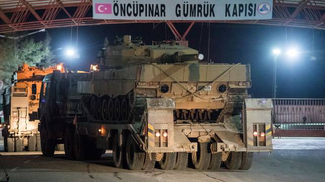 Turkish military vehicles cross into Syria at Oncupinar border gate in Kilis