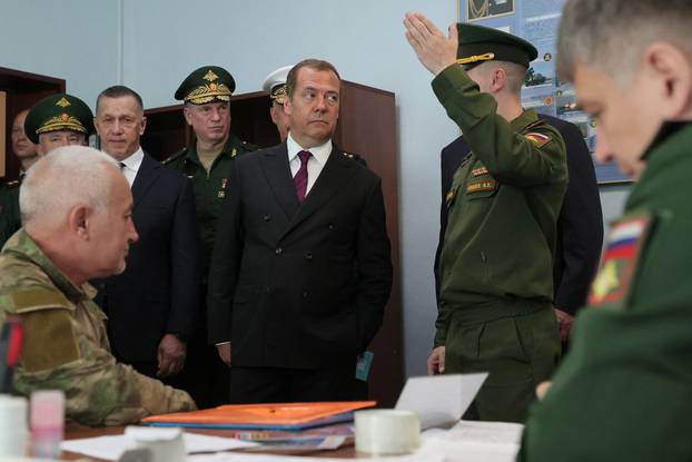 Deputy head of Russia's Security Council Medvedev visits a recruitment office in Yuzhno-Sakhalinsk