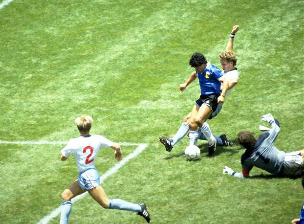 FILE PHOTO: Diego Maradona scores for Argentina