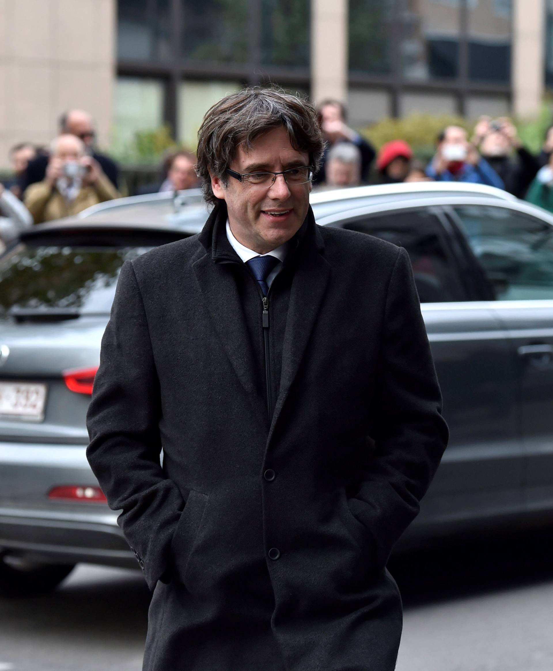 Carles Puigdemont arrives for a news conference in Brussels