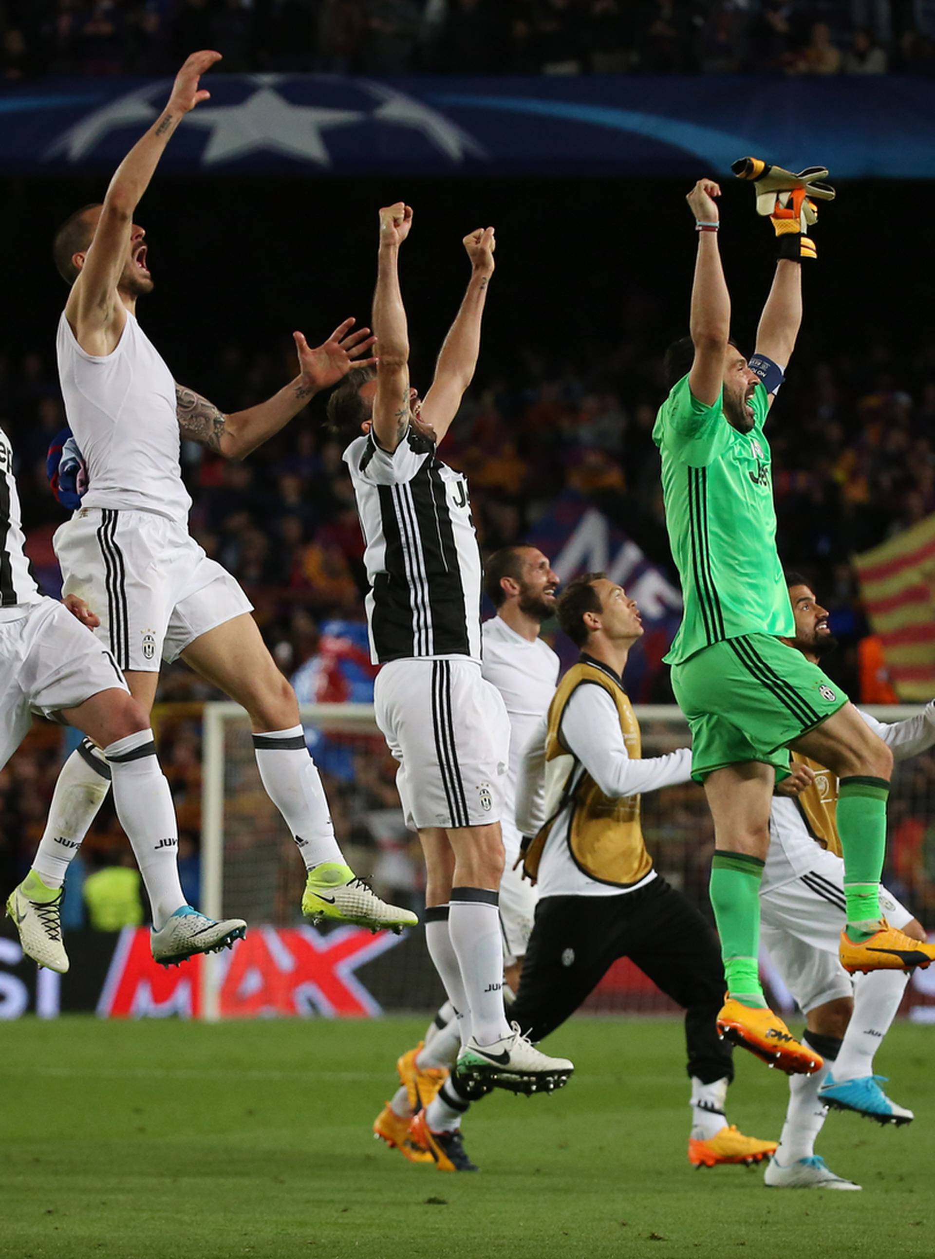 Juventus' Gianluigi Buffon celebrates with teammates after the match