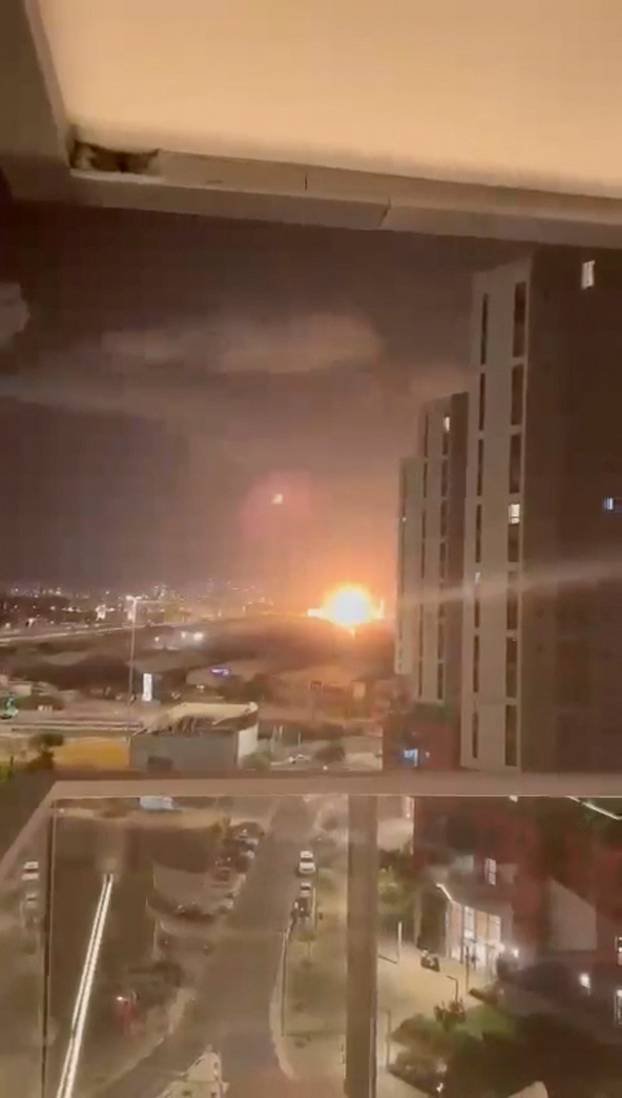 A missile explodes, as Iran fires a salvo of ballistic missiles at Israel, in Herzliya, Tel Aviv