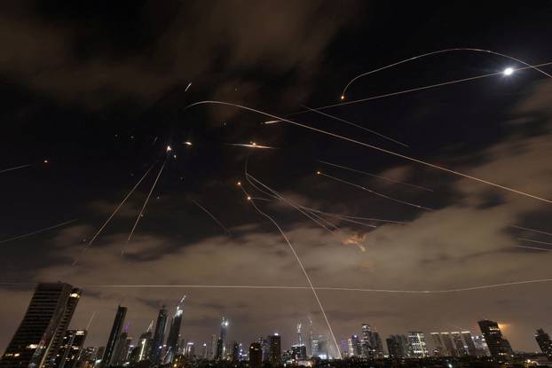 Missiles launched from Iran are intercepted as seen from Tel Aviv