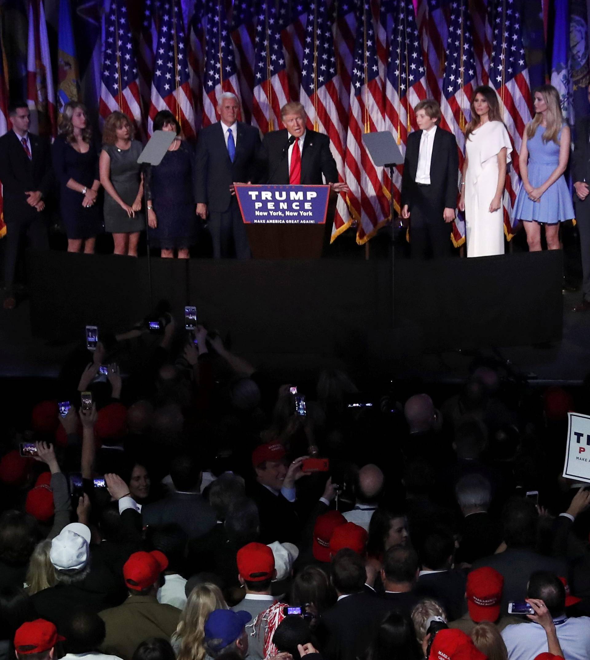 U.S. President-elect Trump is flanked by members of his family as well as relatives of Vice President-elect Pence while speaking at his election night rally in New York
