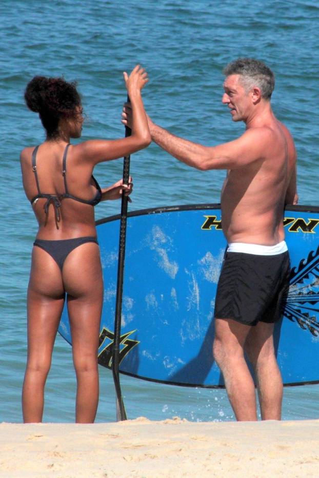*EXCLUSIVE* Shirtless Vincent Cassel joins bikini-clad model girlfriend Tina Kunakey on beach break in Brazil