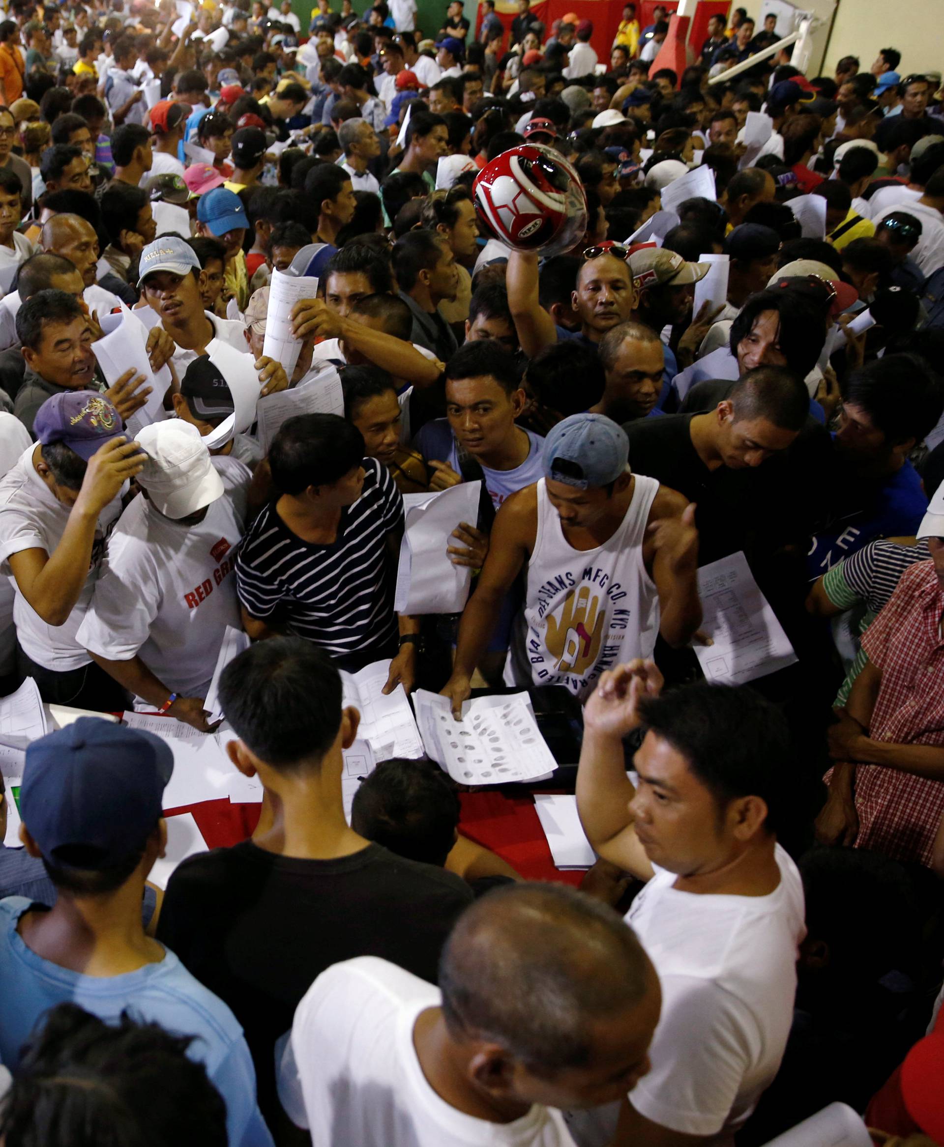 Drug users and pushers take part in a government campaign against drug as they surrender to local officials in Tanauan Batangas, south of Manila