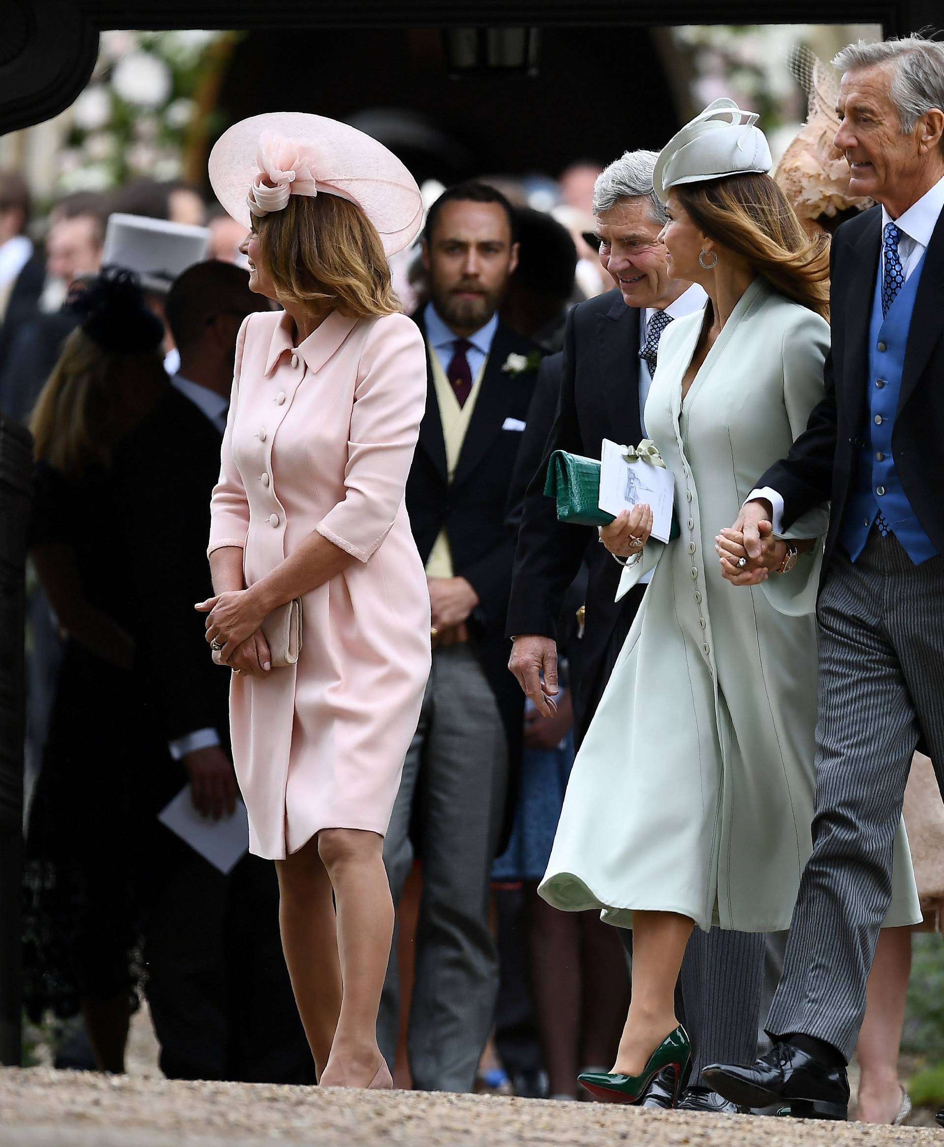 FILE PHOTO: FILE PHOTO: Carole Middleton and her husband Michael Middleton leave after attending the wedding of their daughter Pippa Middleton to James Matthews at St Mark's Church in Englefield