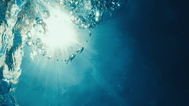 Underwater bubbles with sunlight. Underwater background bubbles.