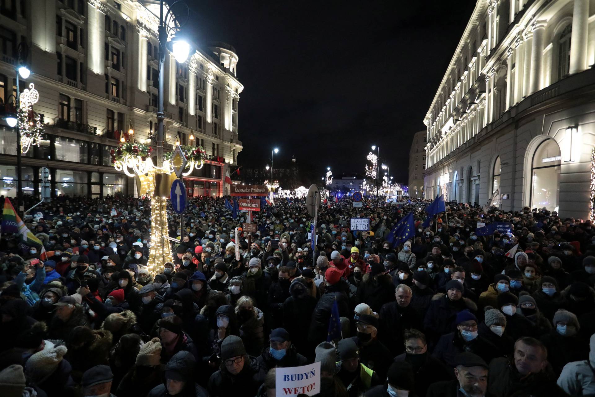 People protest against media law affecting U.S.-owned news channel in Warsaw