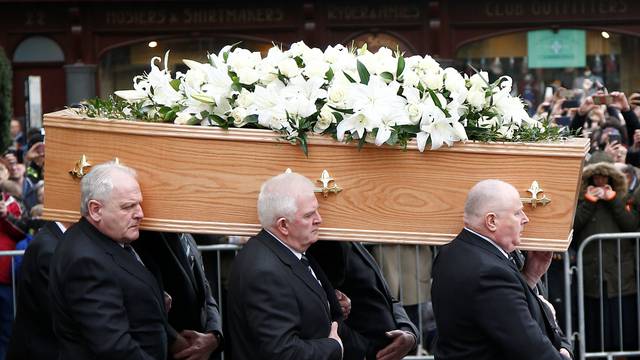 Pallbearers carry the coffin out of Great St Marys Church at the end of the funeral of theoretical physicist Prof Stephen Hawking, in Cambridge