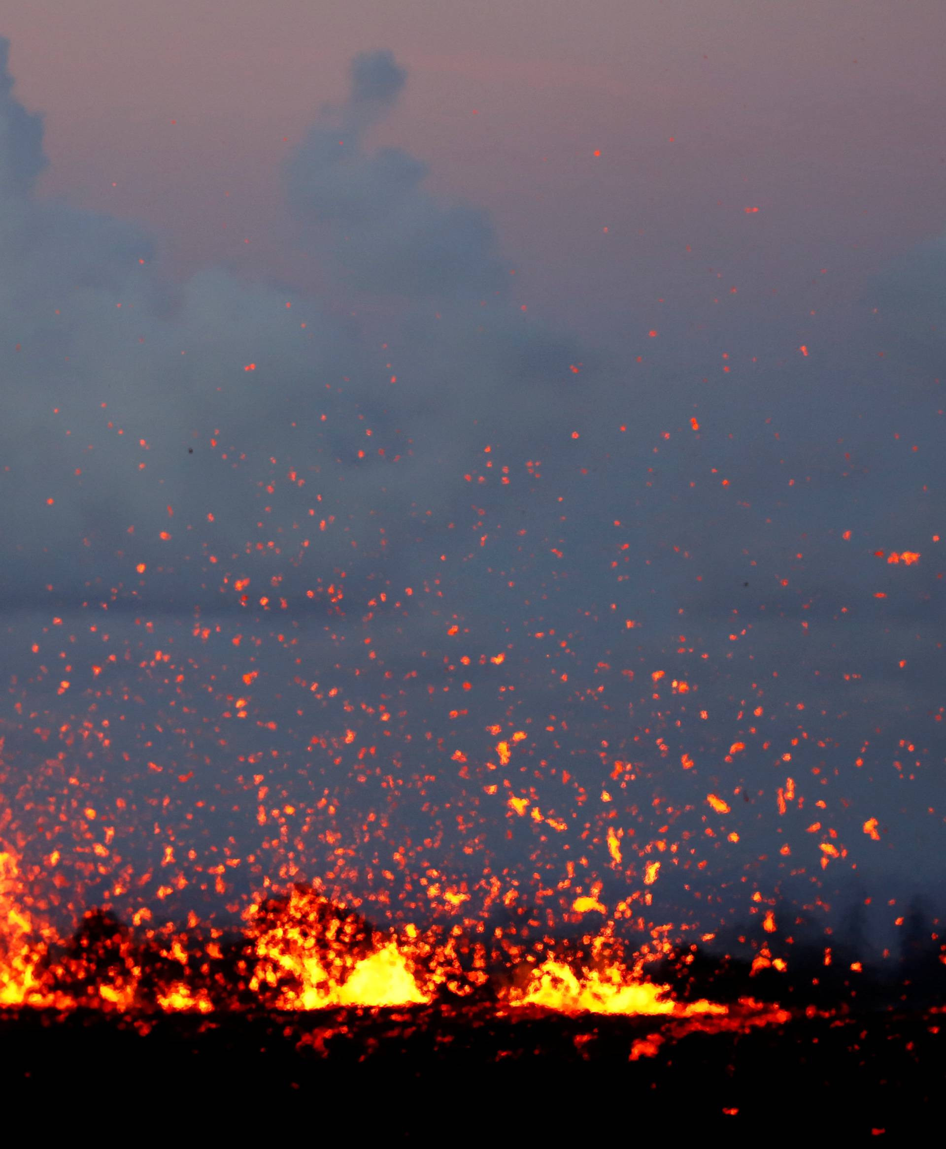 Lava erupts from a fissure on the outskirts of Pahoa