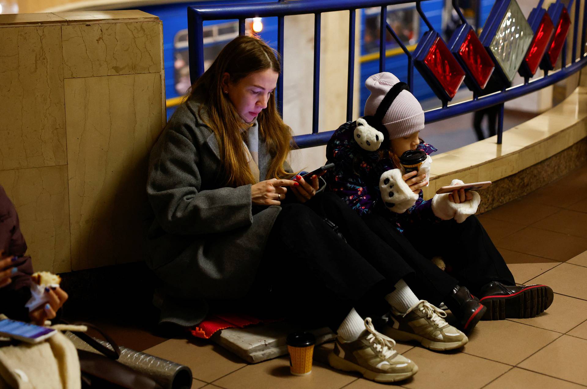 People take shelter during a Russian missile and drone attack, in Kyiv