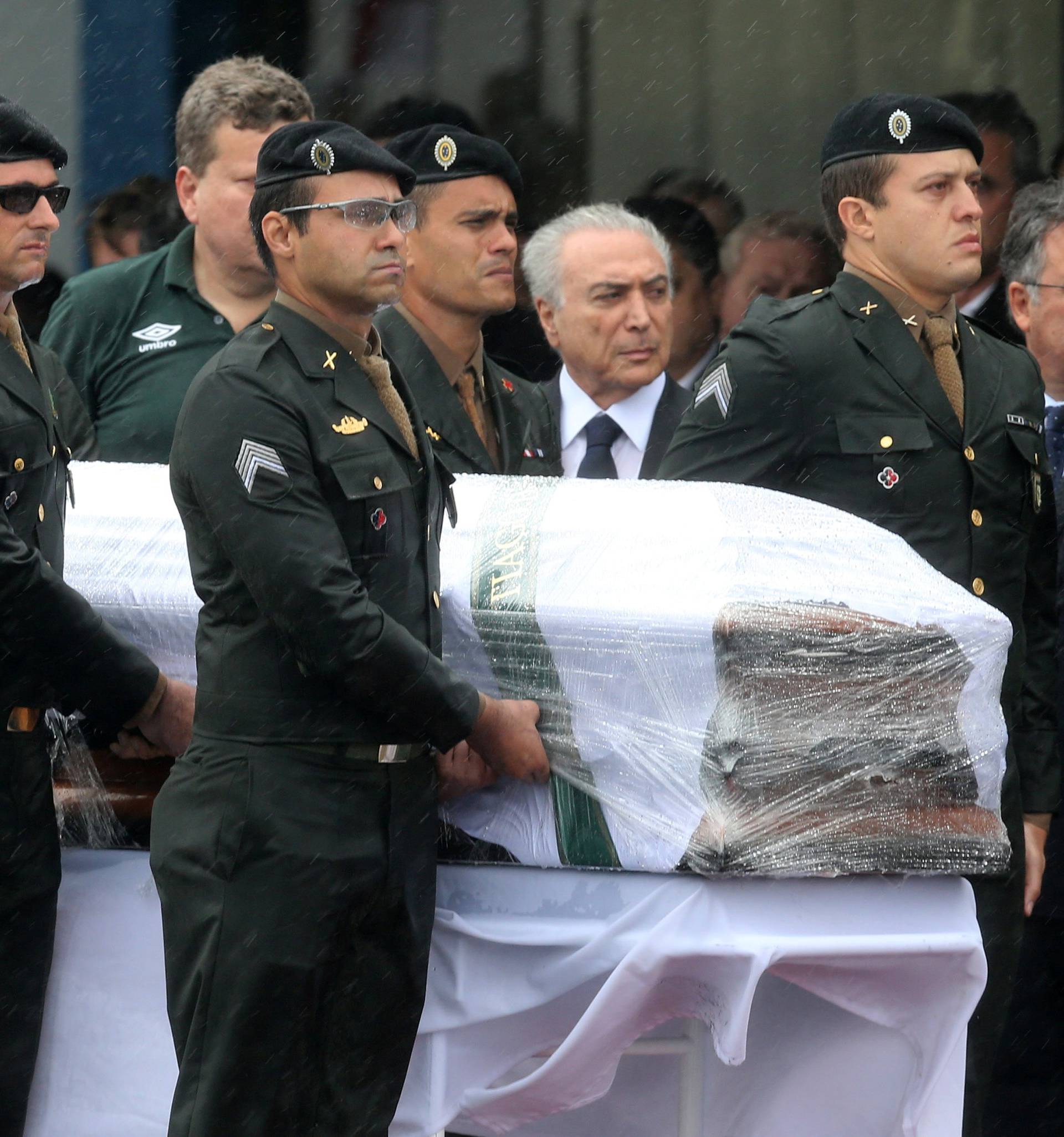 Brazilian President Michel Temer receives the coffin of Chapecoense player Thiaguinho in Chapeco