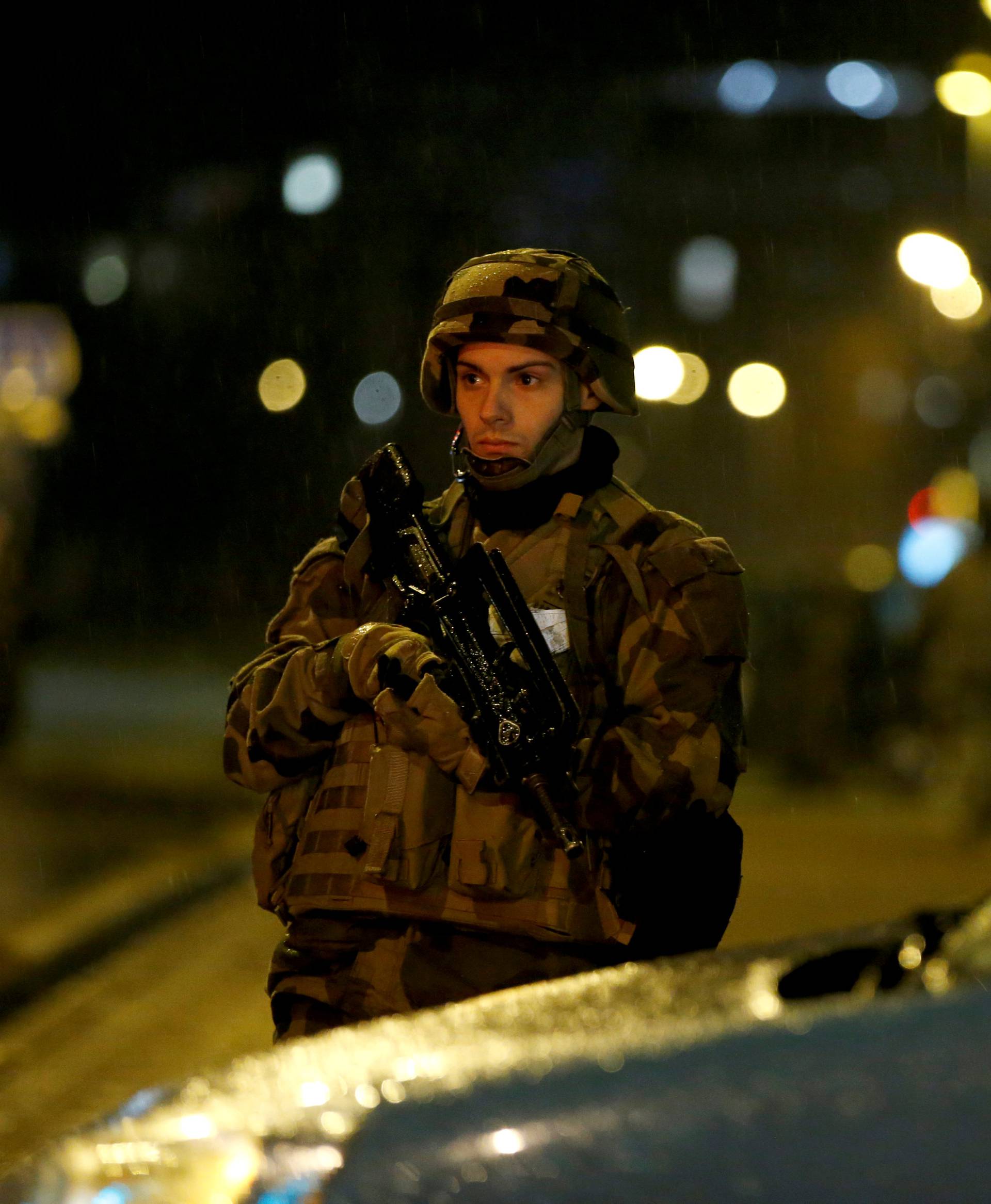 Soldier secures area where a suspect is sought after a shooting in Strasbourg