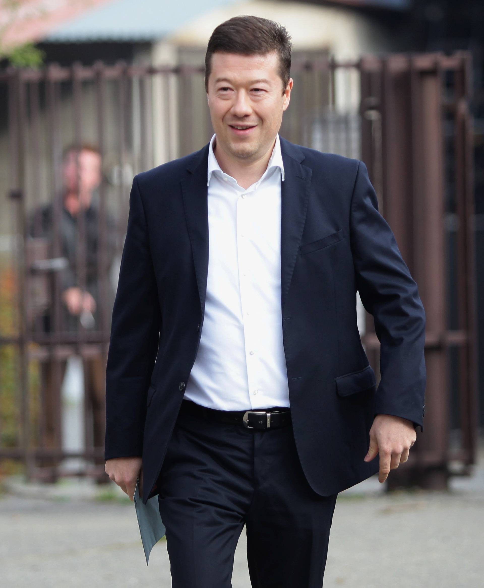 The leader of Freedom and Direct Democracy (SPD) party Tomio Okamura arrives to cast his vote in parliamentary election in Prague
