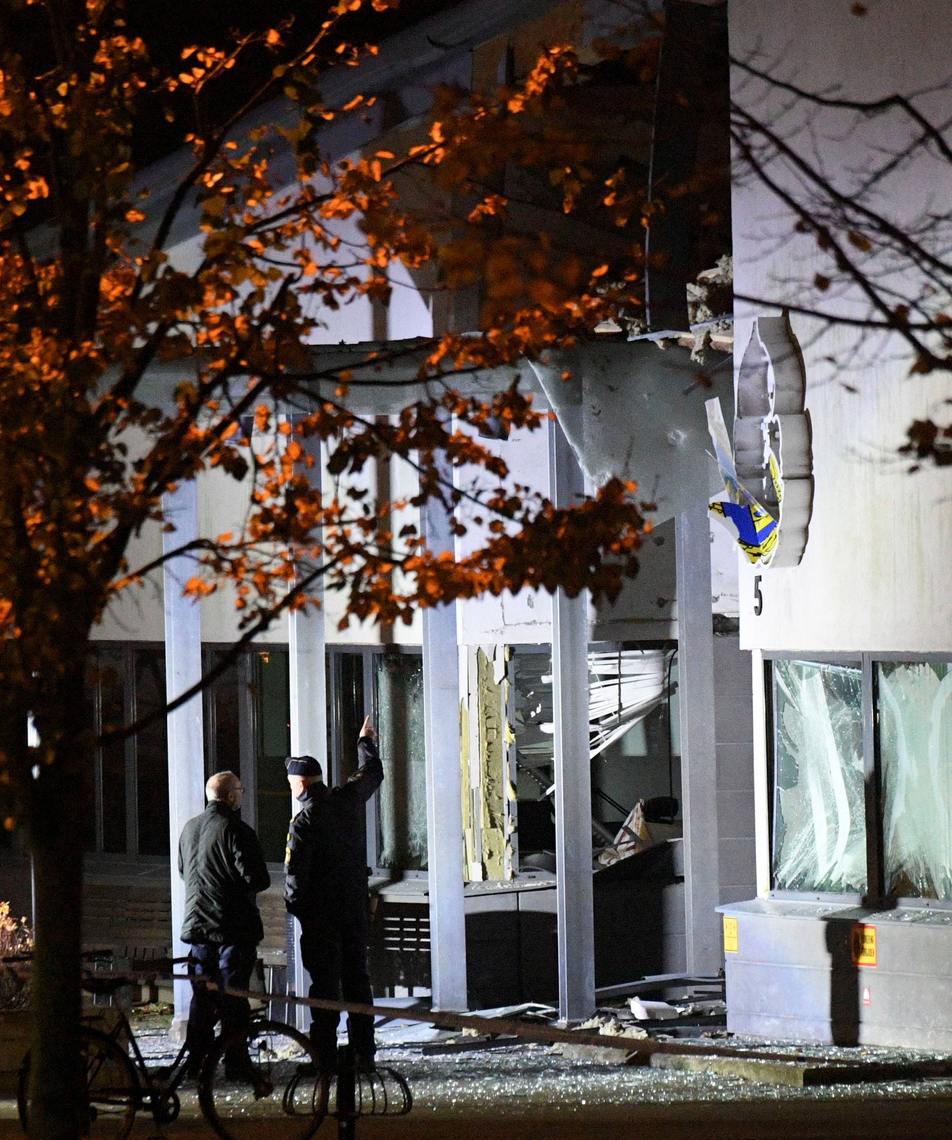 Police forensics work at the scene after a powerful explosion at the main entrance to the police station in Helsingborg