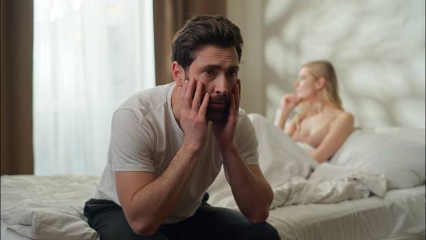 Sad Caucasian man suffering boyfriend girlfriend thinking conflict couple argument partners ignoring each other guy girl family divorce at home husband wife breakup frustrated woman problem headache