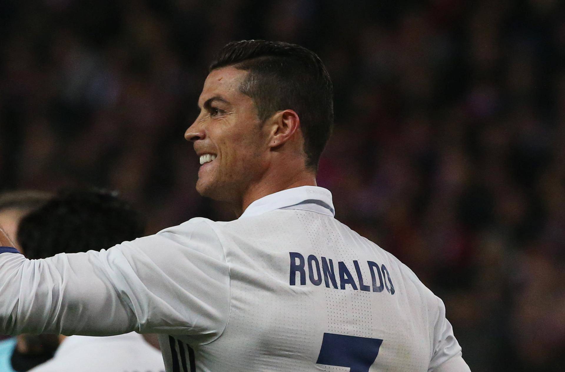 Real Madrid's Cristiano Ronaldo celebrates scoring their third goal to complete his hat trick