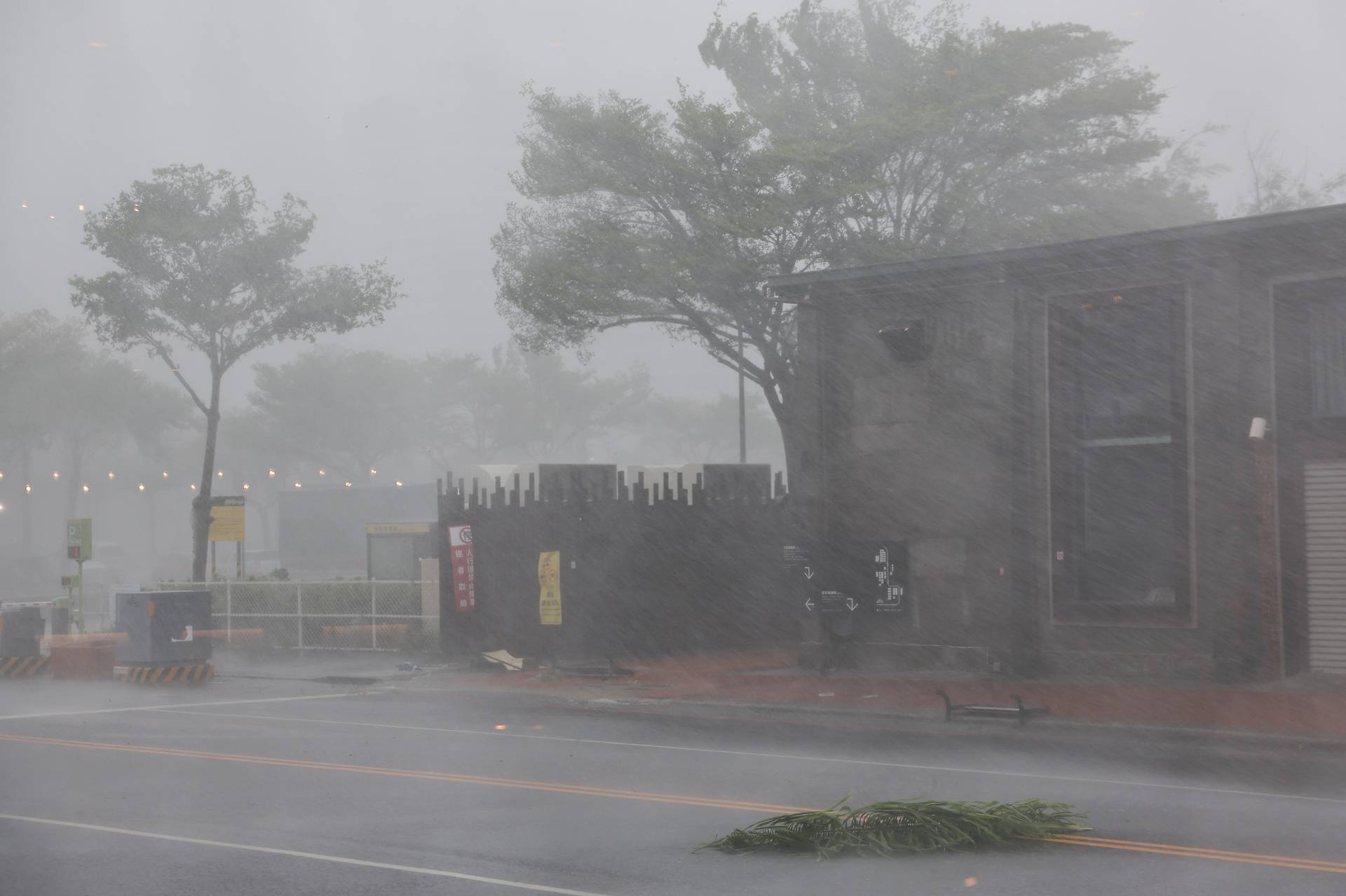 A view shows an empty street with heavy rain and wind as Typhoon Krathon approaches, in Kaohsiung