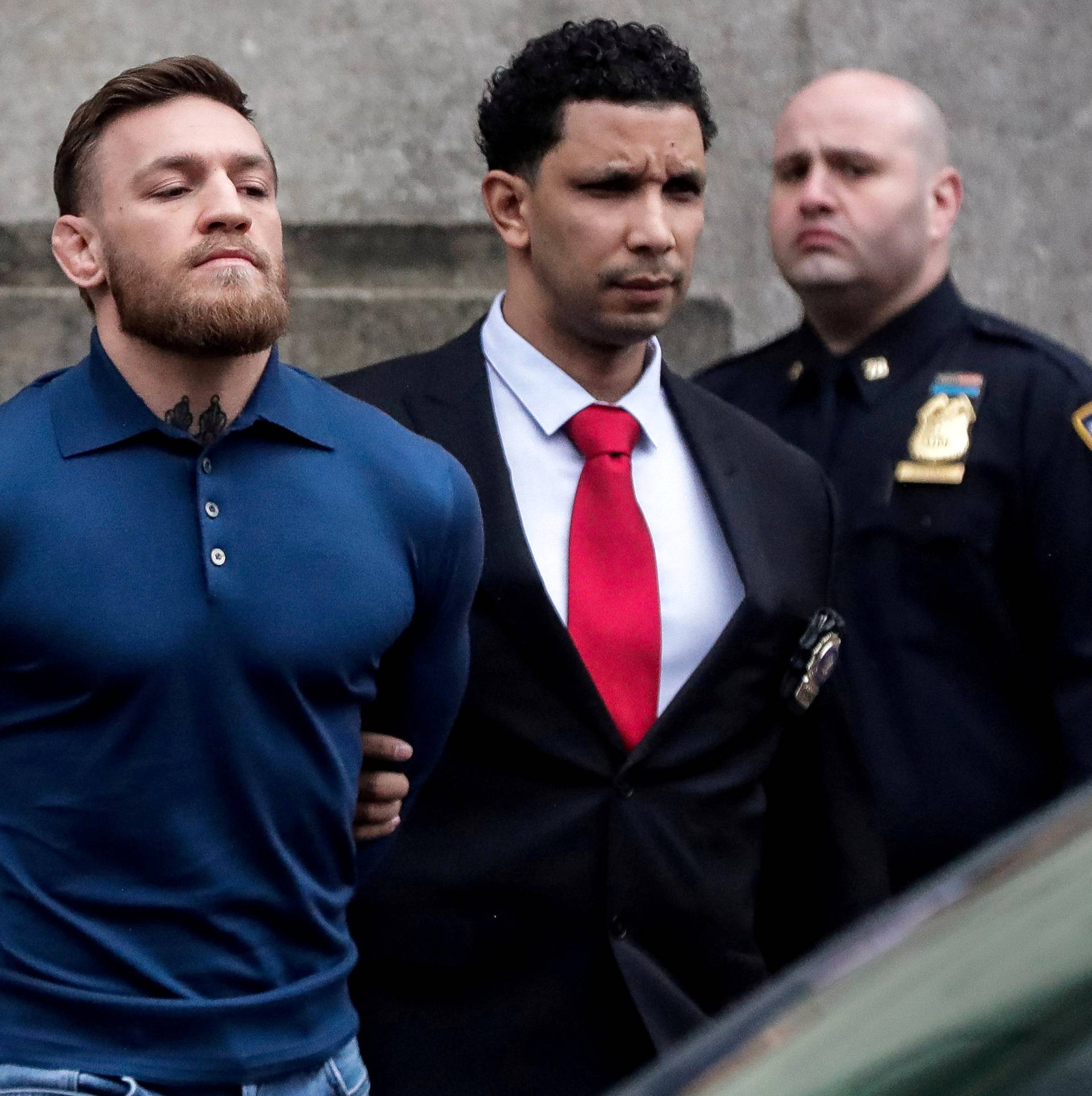 FILE PHOTO: MMA fighter McGregor walks out of the 78th police precinct after charges were laid against him in the Brooklyn borough of New York City