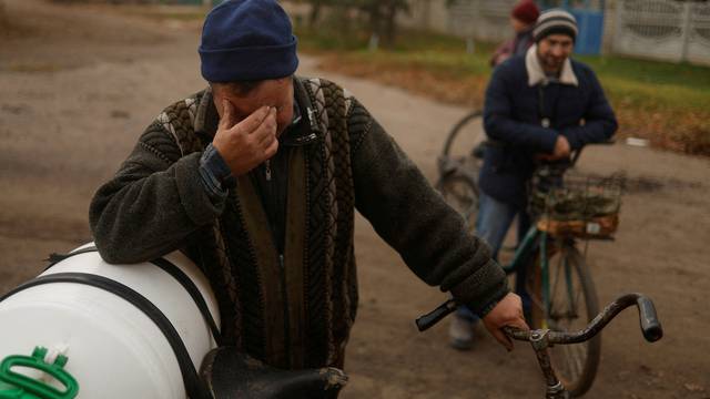 Vadym Slobodianiuk, 48, reacts as he speaks about death of his parents during Russian occupation in the village of Blahodatne in Kherson region