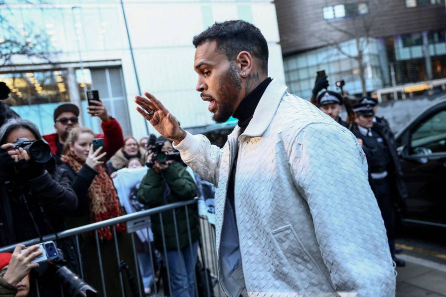 U.S. singer Chris Brown appears outside the Southwark Crown Court, in London