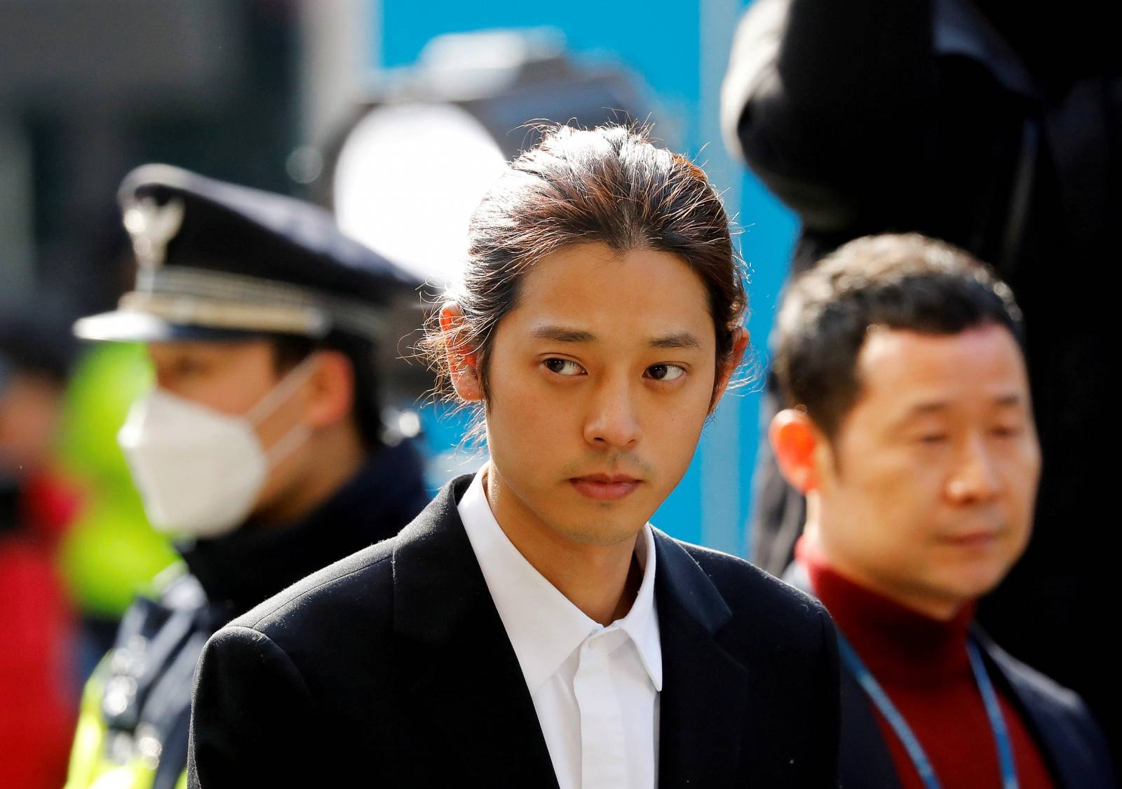 FILE PHOTO: South Korean singer Jung Joon-young arrives for questioning on accusations of illicitly taping and sharing sex videos on social media, at the Seoul Metropolitan Police Agency in Seoul