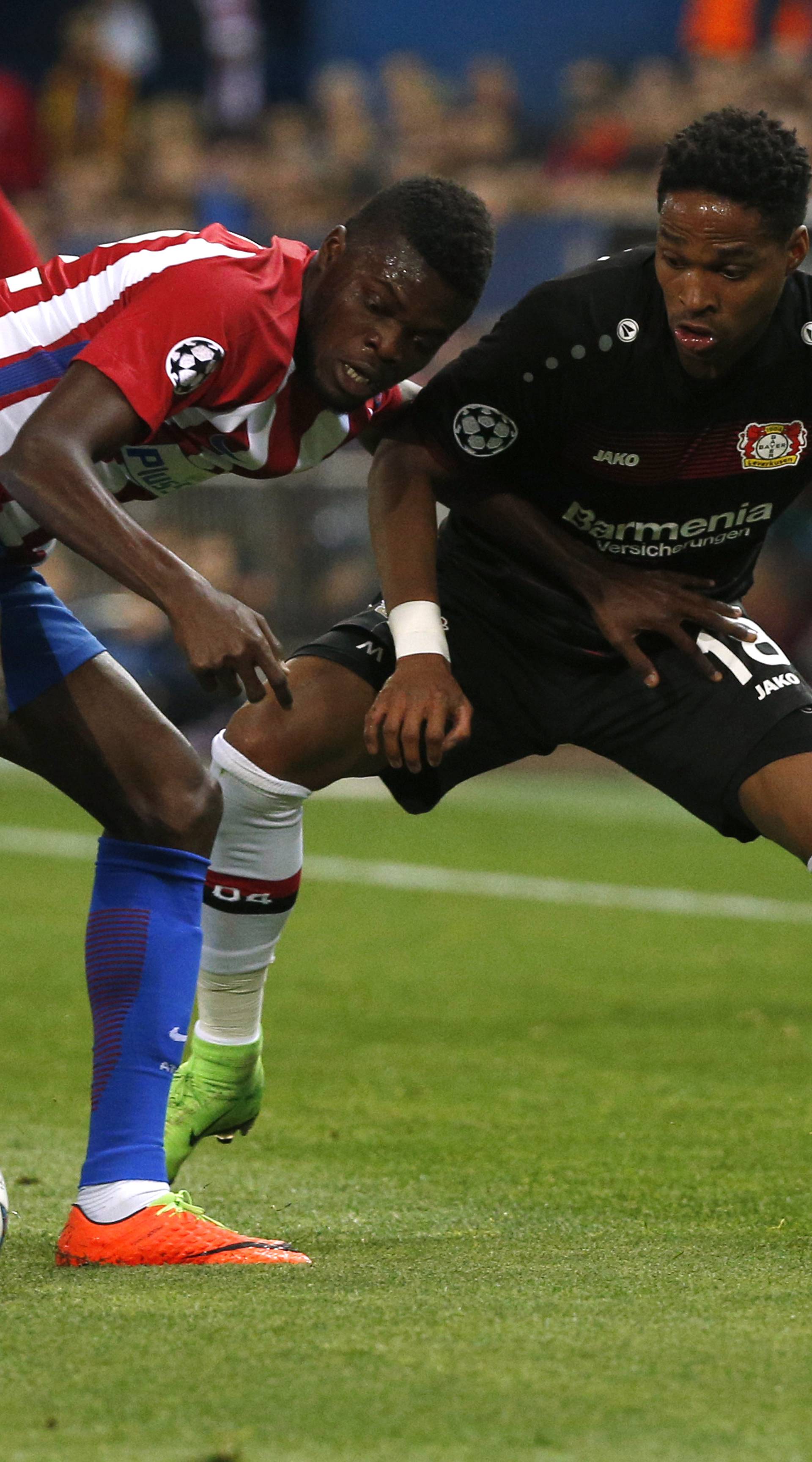 Atletico Madrid's Thomas in action with Bayer Leverkusen's Wendell