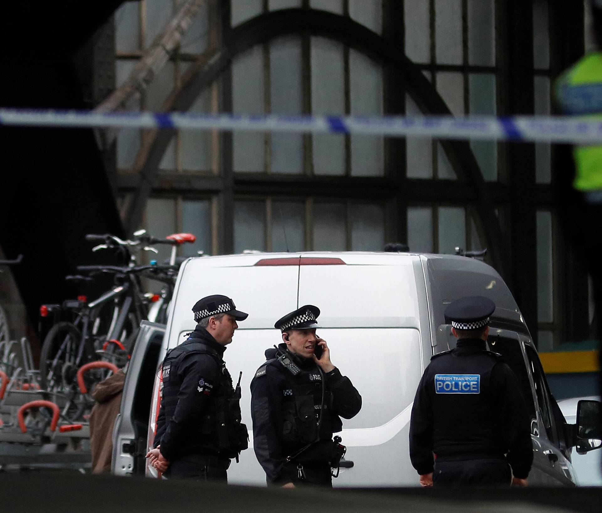 Police officers secure a cordoned off area at Waterloo station near to where a suspicious package was found, in London