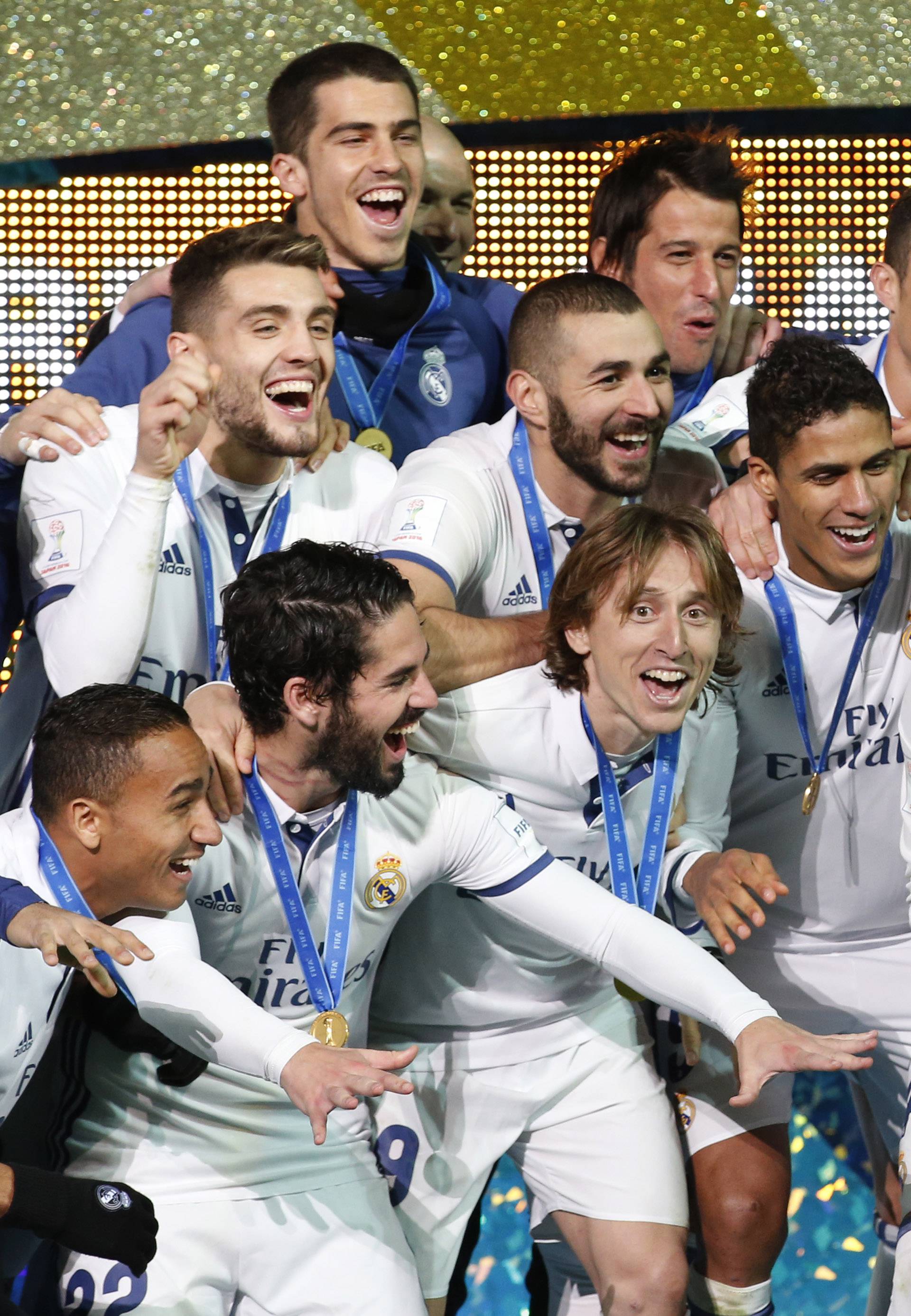 Real Madrid's Sergio Ramos and team mates celebrate winning the FIFA Club World Cup Final with the trophy