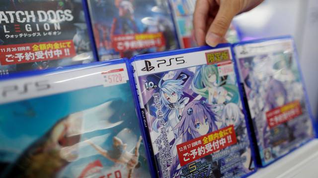 The logos of Sony PlayStation 5 are seen on the package of its' gaming software at the consumer electronics retailer chain Bic Camera in Tokyo