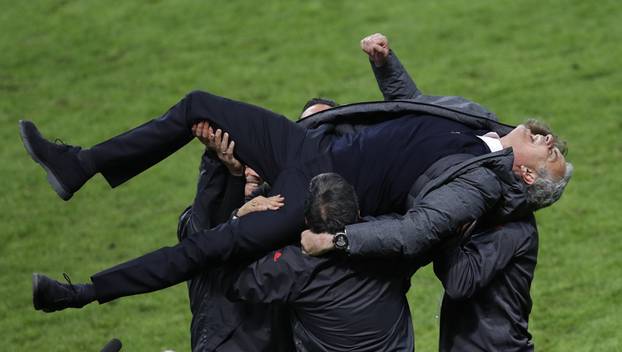 Manchester United manager Jose Mourinho celebrates with coaching staff
