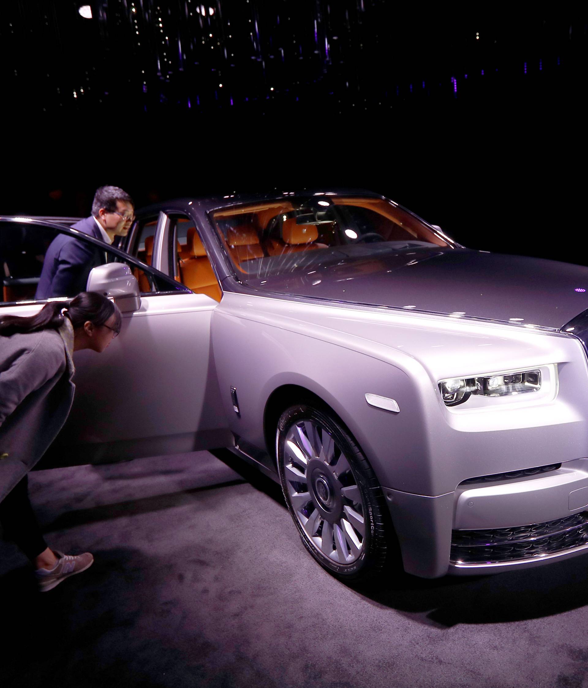 Invited guests view the new Rolls-Royce Phantom as it is premiered at an event at Bonhams, in London